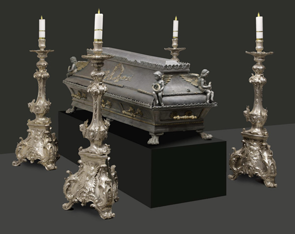 Tin coffin, gilded, 19th century, surrounded by silver candleholders dated to the Middle of 18th century St. Stanislaus Church in Waplewo, Archcathedral Basilica of the Assumption of the Blessed Virgin Mary in Frombork